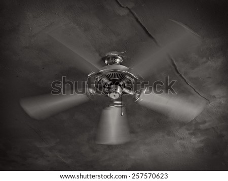 A ceiling fan at work in an old building in a topical climate.
