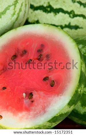 Juicy watermelon cut to show glowing red interior for sale at local farm market