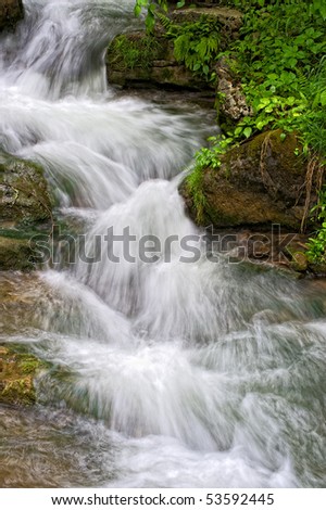 Small waterfall cascade in Virginia filled with Spring runoff
