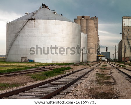 Grain elevator and large grain storage bin in Amarillo, Texas, on historic Route 66.  Railroad siding