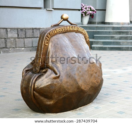 RUSSIA, NIZHNY NOVGOROD - JUNE 15, 2015: Sculpture of coin purse - symbol of stability and well-being.