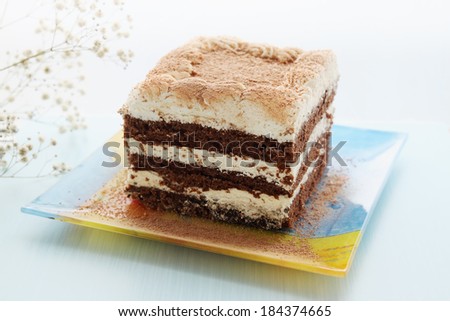 chocolate cake with butter cream and cocoa