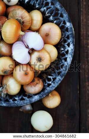 small onion in an old metal bowl