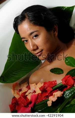 beautiful asian woman in floral bath looking