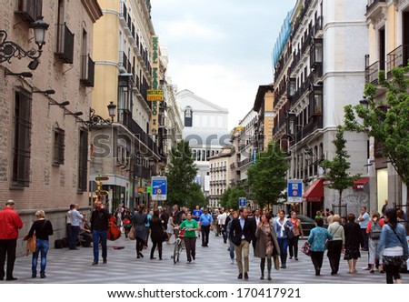 MADRID, SPAIN - APRIL 9: People walking on the street Arenal background Royal Opera House, May 9, 2013 in Madrid, Spain.