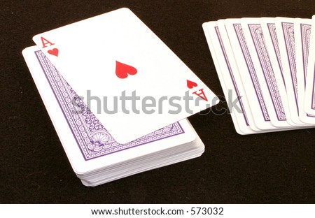Ace turns up on deck with cards fanned to right.