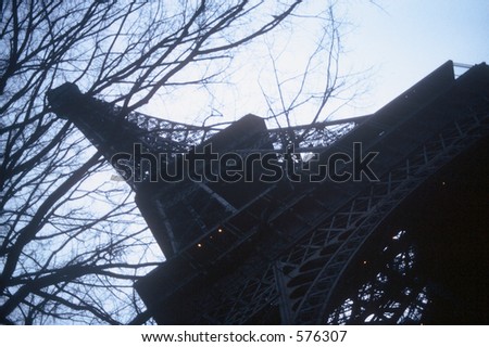 Eiffel Tower in Paris on a slant during winter gives edgy feel to well known landmark.