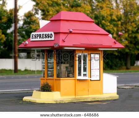 Red roofed parking lot Espresso stand with drive-through window.