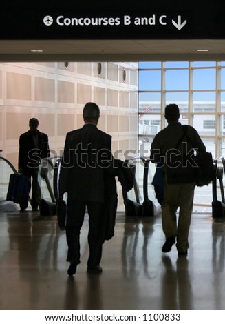Business travelers head to the gates