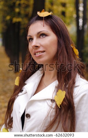 Beautiful girl with yellow leaf on head. More images of this models you can find in my portfolio