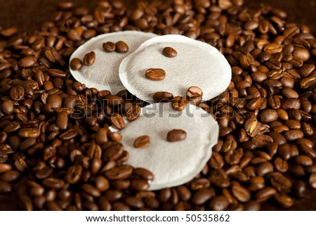 Close-up of individual coffee beans with coffee pads