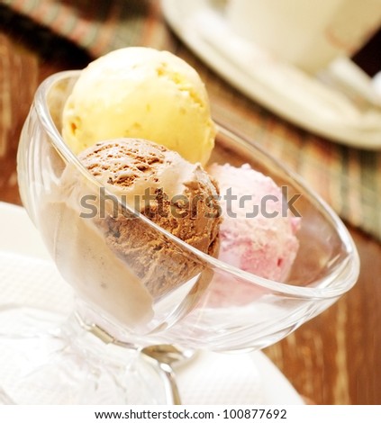 Multi-colored balls of delightful fruit ice-cream in glasswares