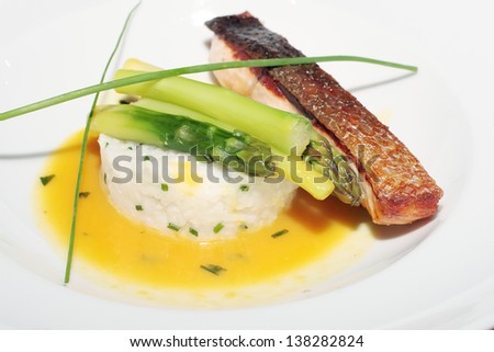 delightful baked fish with white rice and a green asparagus on a white plate, a diet, health