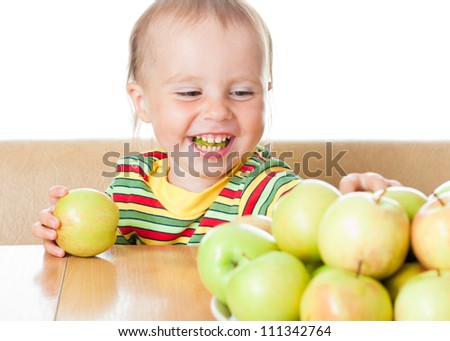 Baby eating apple on a white background.