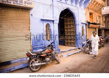 Jodhpur, India - January 3, 2015 : A street scene with indian man in the old blue city of Jodhpur in Rajasthan, India