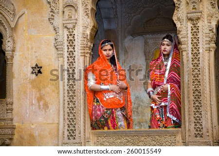Jaisalmer, India - 2015, January 7 : Two female Indian tourists dressed up in traditional clothing and posing for a photograph in the Patwon Ki Haveli in Jaisalmer, Rajasthan