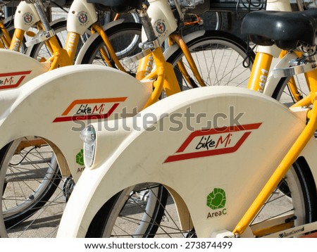 Milan, Italy - October 16, 2014: Bicycles in the Piazza del Duomo used in the bike sharing scheme BikeMi in Milan, Italy