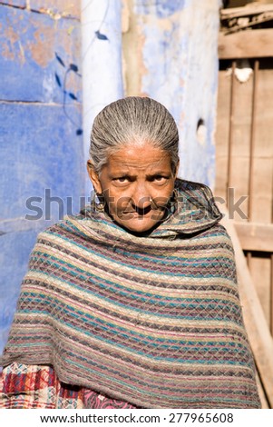 Jodhpur, India - January 3, 2015 : An old lady in traditional dress in the blue city of Jodhpur in central Rajasthan in India