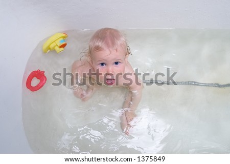 funny baby having a bath