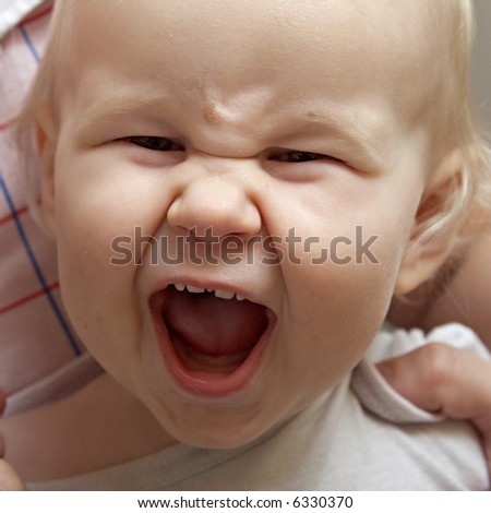close-up portrait of happy smiling baby on white background