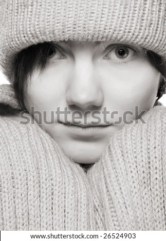 beautiful woman in hat and knitted scarf