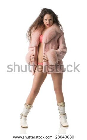 beautiful sexual girl  in a pink swimming suit, in a pink fur coat and in white knee-boots