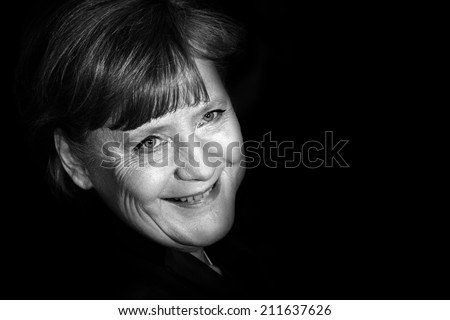 BERLIN, GERMANY - FEBRUARY 13: German Chancellor Angela Merkel and Bernd Neumann attend the \'Pina\' Premiere during of the 61st Berlin Film Festival at Palace on February 13, 2011 in Berlin, Germany