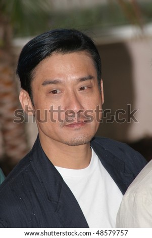 CANNES, FRANCE - MAY 14:  Director Johnny To  attends a photo call promoting the film \'Election\' at the Palais during the 58th International Cannes Film Festival May 14, 2005 in Cannes, France