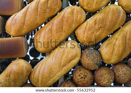Loaves of bread put out at grocery stand