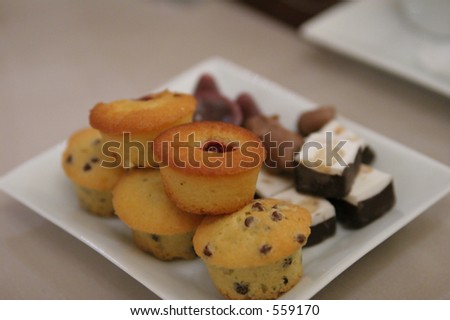 Cake, biscuits and sweeties offered with coffee