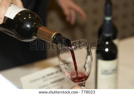 Red wine poured during a bordeaux wine tasting