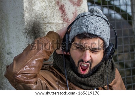 beard man hearing music