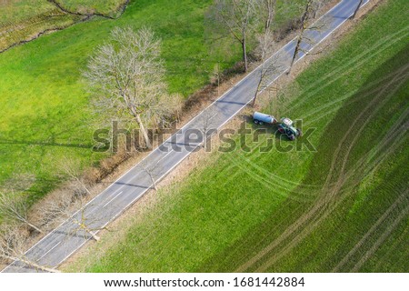 Similar – Foto Bild Traktor, der Kuhdung von oben besprüht #2