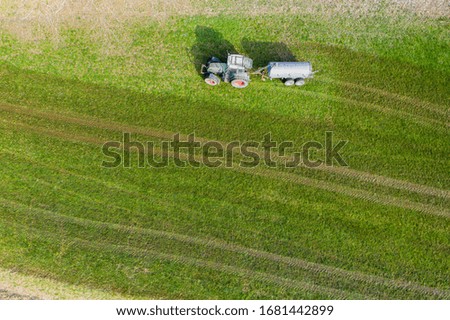 Similar – Foto Bild Traktor, der Kuhdung von oben besprüht #2