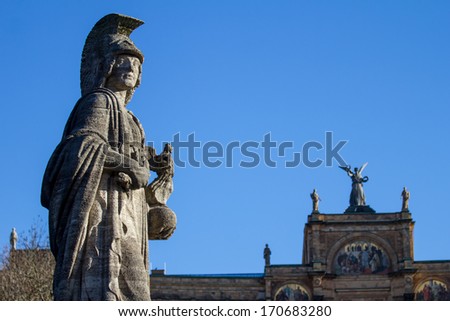 statue of a Roman in front of the Maximilianeum