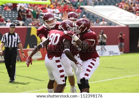 PHILADELPHIA, PA. - SEPTEMBER 8: Temple players celebrate a touchdown reception in the end zone during a game against Maryland September 8, 2012 at Lincoln Financial Field in Philadelphia, PA.