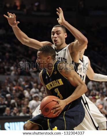 UNIVERSITY PARK, PA -  FEBRUARY 27: Michigan\'s Trey Burke drives to the basket against Penn State  at the Byrce Jordan Center February 27, 2013 in University Park, PA