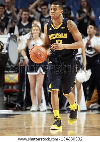 UNIVERSITY PARK, PA - February 27: Michigan\'s Trey Burke dribbles the basketball up the court during  a game against Penn State at the Byrce Jordan Center February 27, 2013 in University Park, PA