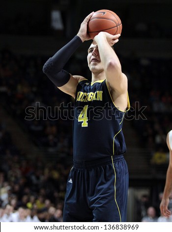 UNIVERSITY PARK, PA - FEBRUARY 27: Michigan\'s Mitch McGary No. 4 shoots a free throw against Penn State at the Byrce Jordan Center February 27, 2013 in University Park, PA