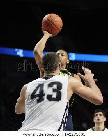 UNIVERSITY PARK, PA - FEBRUARY 27: Michigan\'s #3 Trey Burke shoots against Penn State at the Byrce Jordan Center February 27, 2013 in University Park, PA