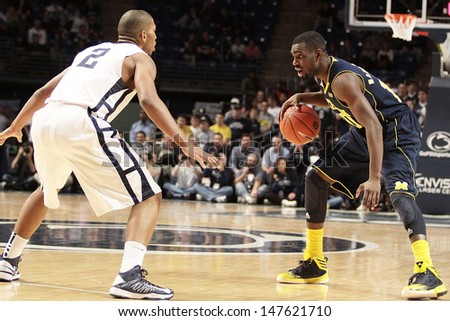 UNIVERSITY PARK, PA - FEBRUARY 27: Michigan\'s Tim Hardaway brings the ball up the court against Penn State at the Byrce Jordan Center February 27, 2013 in University Park, PA