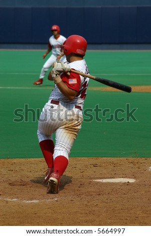 Baseball Batter swinging hard a pitch