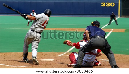 Baseball Batter in the middle of his swing, high-action