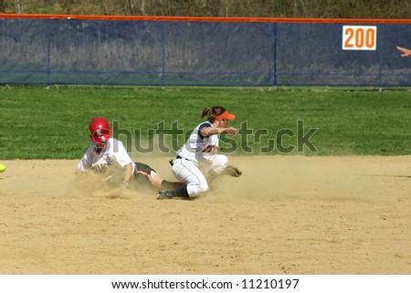 Sliding into second base, women\'s softball