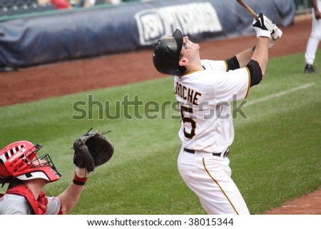PITTSBURGH - SEPTEMBER 24 : Andy LaRoche of Pittsburgh Pirates swings at a pitch and hits a pop-up against the Cincinnati Reds on September 24, 2009 in Pittsburgh, PA.