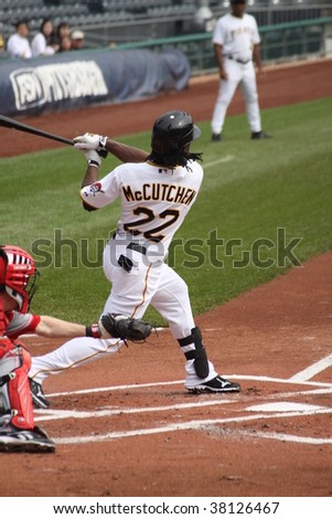 PITTSBURGH - SEPTEMBER 24 : Andrew McCutchen of Pittsburgh Pirates swings at a pitch against Cincinnati Reds on September 24, 2009 in Pittsburgh, PA.