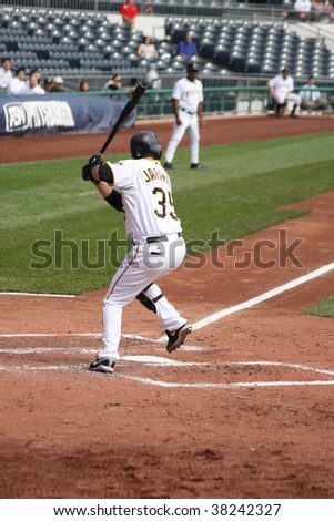 PITTSBURGH - SEPTEMBER 24 : Jason Jaramillo of Pittsburgh Pirates swings at a pitch against Cincinnati Reds on September 24, 2009 in Pittsburgh, PA.