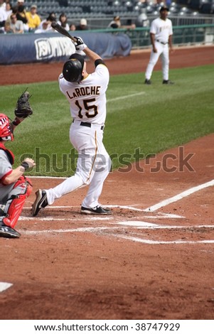 PITTSBURGH - SEPTEMBER 24 : Andy LaRoche of the Pittsburgh Pirates swings at a pitch and hits a pop-up against Cincinnati Reds on September 24, 2009 in Pittsburgh, PA.