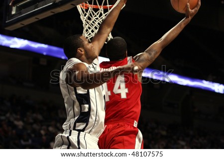 UNIVERSITY PARK, PA -FEBRUARY 24: Ohio State guard William Bufford #44 slams the ball over Bill Edwards #11 in a game against Penn State, Byrce Jordan Center February 24, 2010 in University Park, PA