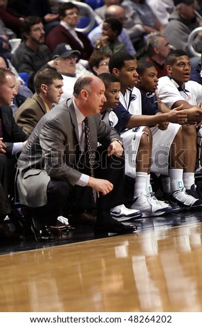 UNIVERSITY PARK, PA - FEBRUARY 24: Penn State\'s head coach, Ed DeChellis, in the gray suit, watches Penn State against Ohio State at the  Byrce Jordan Center February 24, 2010 in University Park, PA